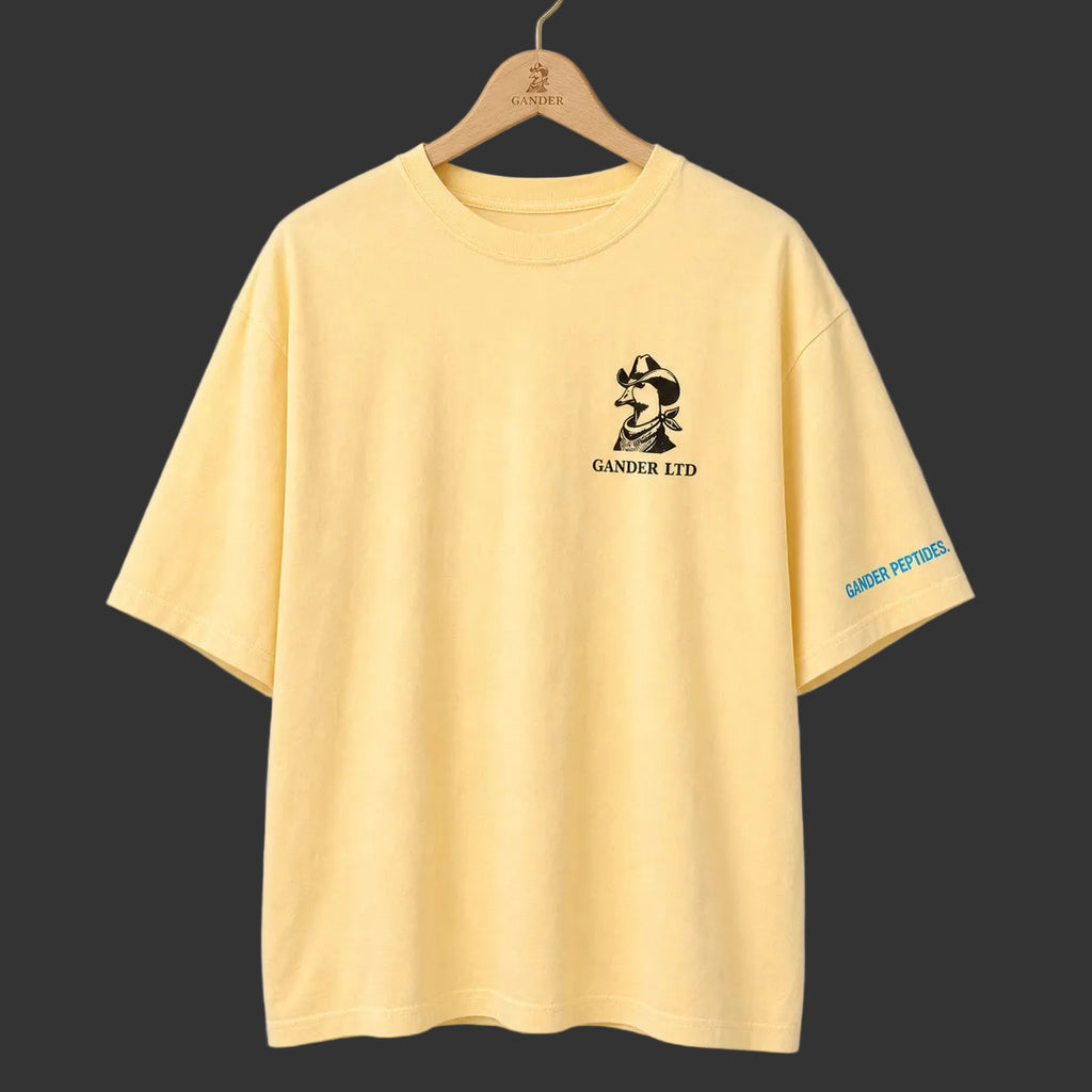 Yellow Gander LTD oversized tee front on a Gander wooden hanger
